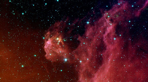 This image from NASA's Spitzer Space Telescope shows infant stars "hatching" in the head of the hunter constellation, Orion.