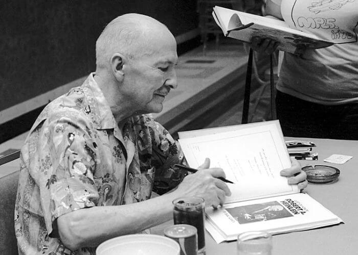 Author Robert A. Heinlein signing a book