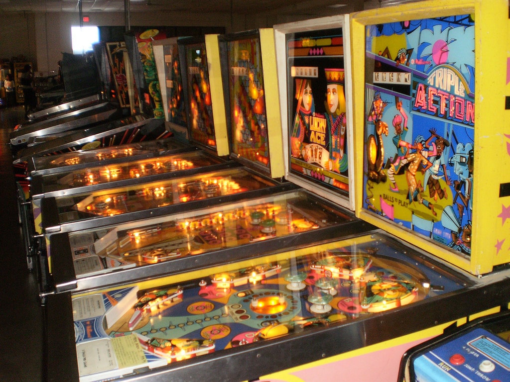 Pinball machines lined up next to each other