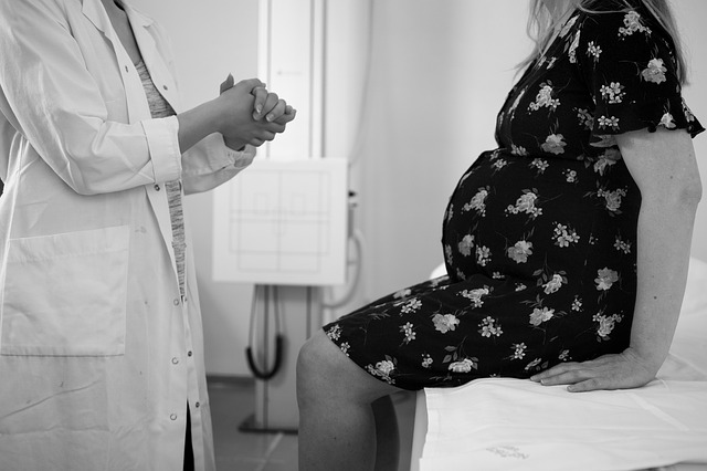 a doctor giving advice to a pregnant woman