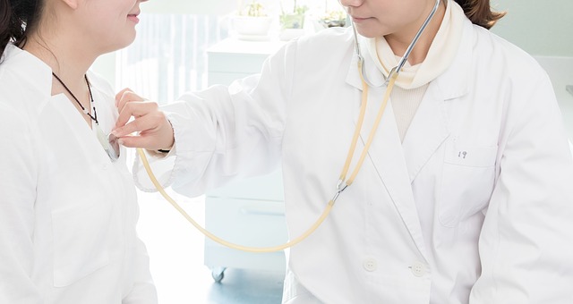a doctor checking up a patient using a stethoscope