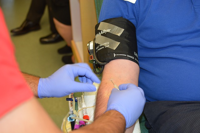 a person extracting blood from a person